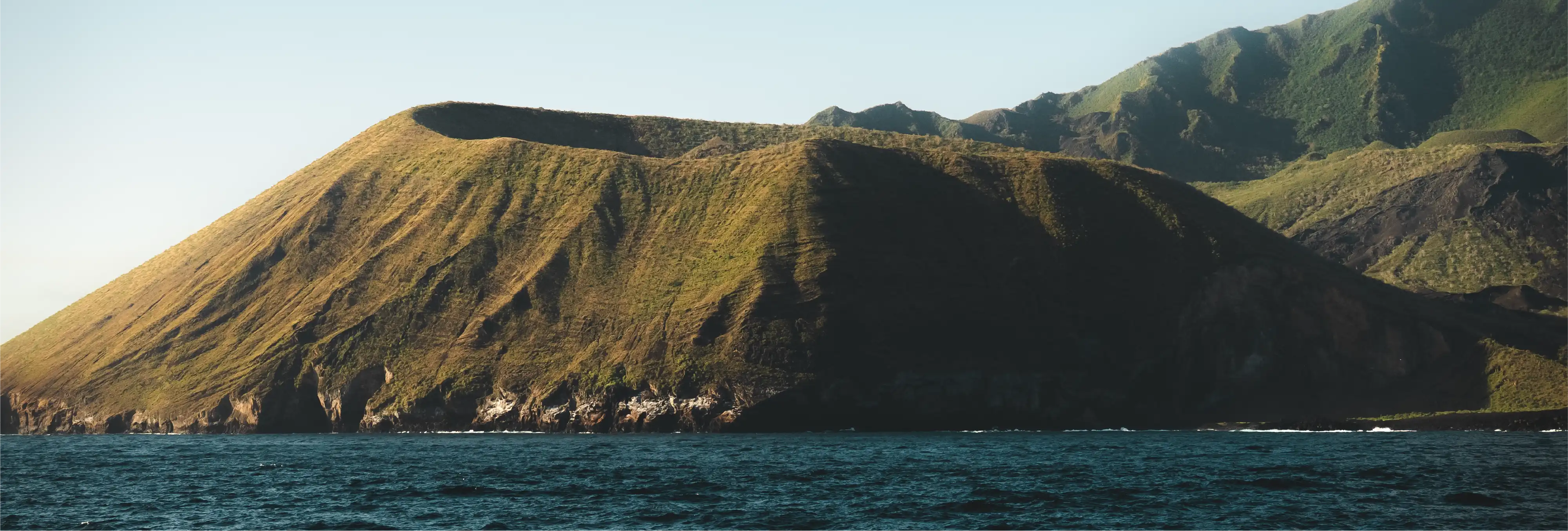 Aerial view of volcanic crater coastline in Galapagos